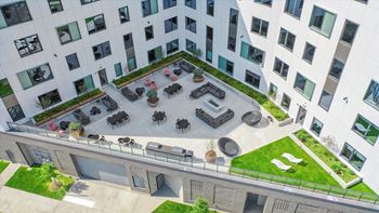 an aerial view of an office building with patio furniture and grass at Inspire West Town, CHICAGO, Illinois